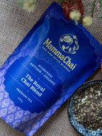 Mamma Chai tea Royal Chai Blend Tea package with a bowl of tea leaves